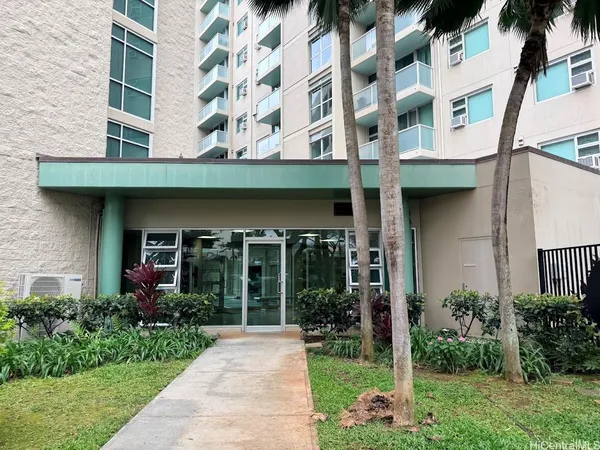 front view of a building with a yard