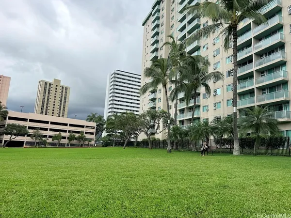 a front view of a building with garden