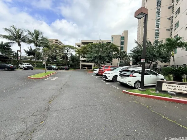 a view of a city street with cars