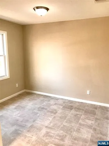 an empty room with a natural light