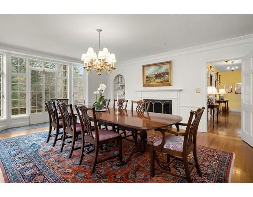 219 Dedham Street Dover, MA 02030 - Photo 13 of 30 a dining room with furniture a chandelier and wooden floor