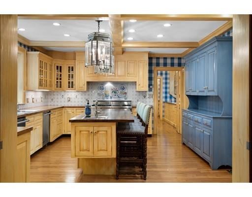 219 Dedham Street Dover, MA 02030 - Photo 14 of 30 a kitchen with kitchen island granite countertop a sink cabinets and stainless steel appliances