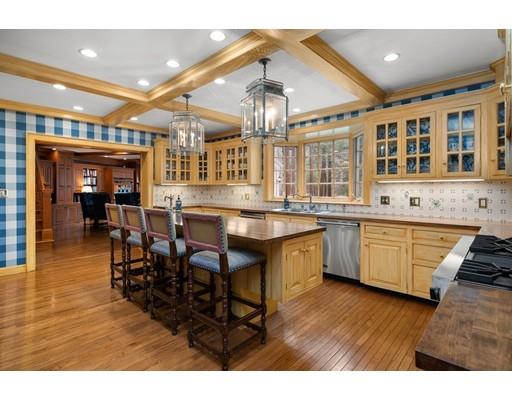 219 Dedham Street Dover, MA 02030 - Photo 15 of 30 a kitchen with stainless steel appliances granite countertop a sink and cabinets