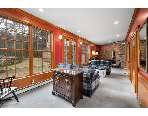 219 Dedham Street Dover, MA 02030 - Photo 19 of 30 a living room with furniture a flat screen tv and large windows