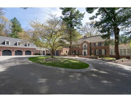 219 Dedham Street Dover, MA 02030 - Photo 2 of 30 a front view of a house with a yard