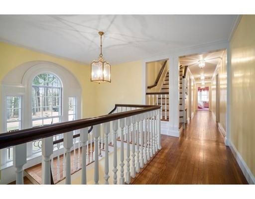 219 Dedham Street Dover, MA 02030 - Photo 21 of 30 a view of a hallway with wooden floor windows