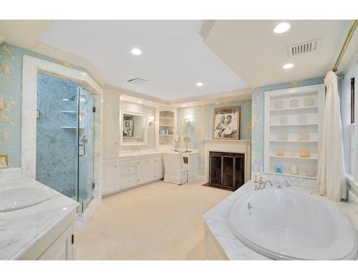 219 Dedham Street Dover, MA 02030 - Photo 23 of 30 a view of a livingroom with a fireplace cabinet and windows