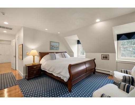 219 Dedham Street Dover, MA 02030 - Photo 28 of 30 a bedroom with a bed lamp and a large window