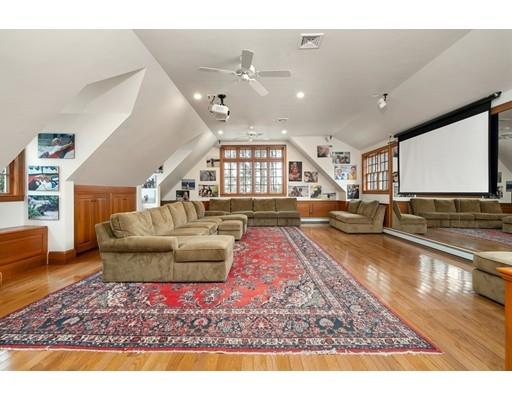 219 Dedham Street Dover, MA 02030 - Photo 29 of 30 a living room with furniture and a flat screen tv