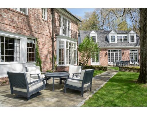 219 Dedham Street Dover, MA 02030 - Photo 4 of 30 a backyard of a house with a garden and barbeque oven