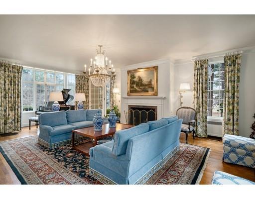 219 Dedham Street Dover, MA 02030 - Photo 8 of 30 a living room with furniture a fireplace and a chandelier