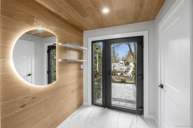 an entryway with wooden floor and door