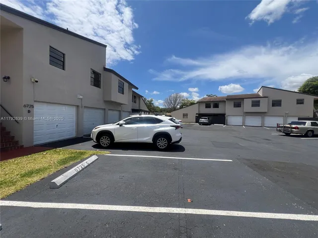 a view of a cars parked in front of a building