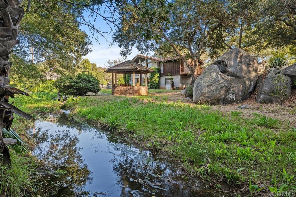 16522 Orchard Bend Road Poway, CA 92064 - Photo 24 of 26 a view of a house with a garden