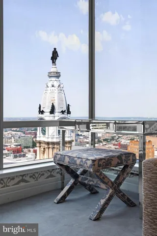 a bathroom with a toilet a sink and a mirror