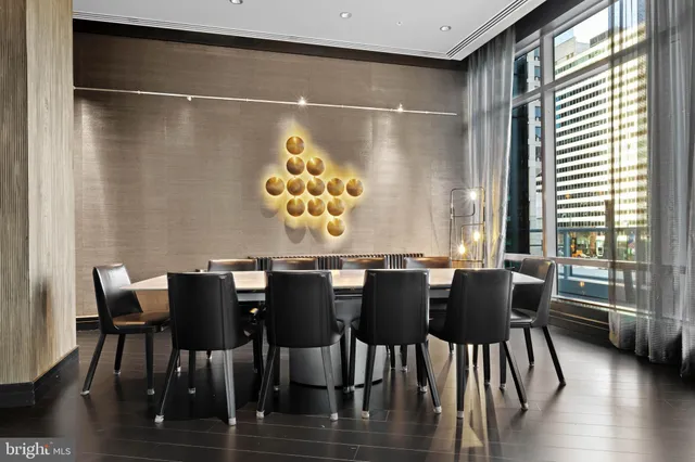 a lobby with furniture and glass door