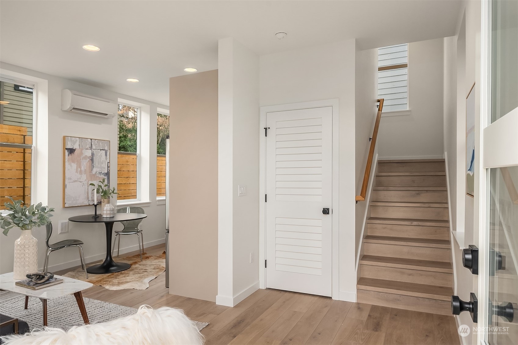 2216 Northeast 75th Street Seattle, WA 98115 - Photo 2 of 23 a view of a hallway with wooden floor and windows
