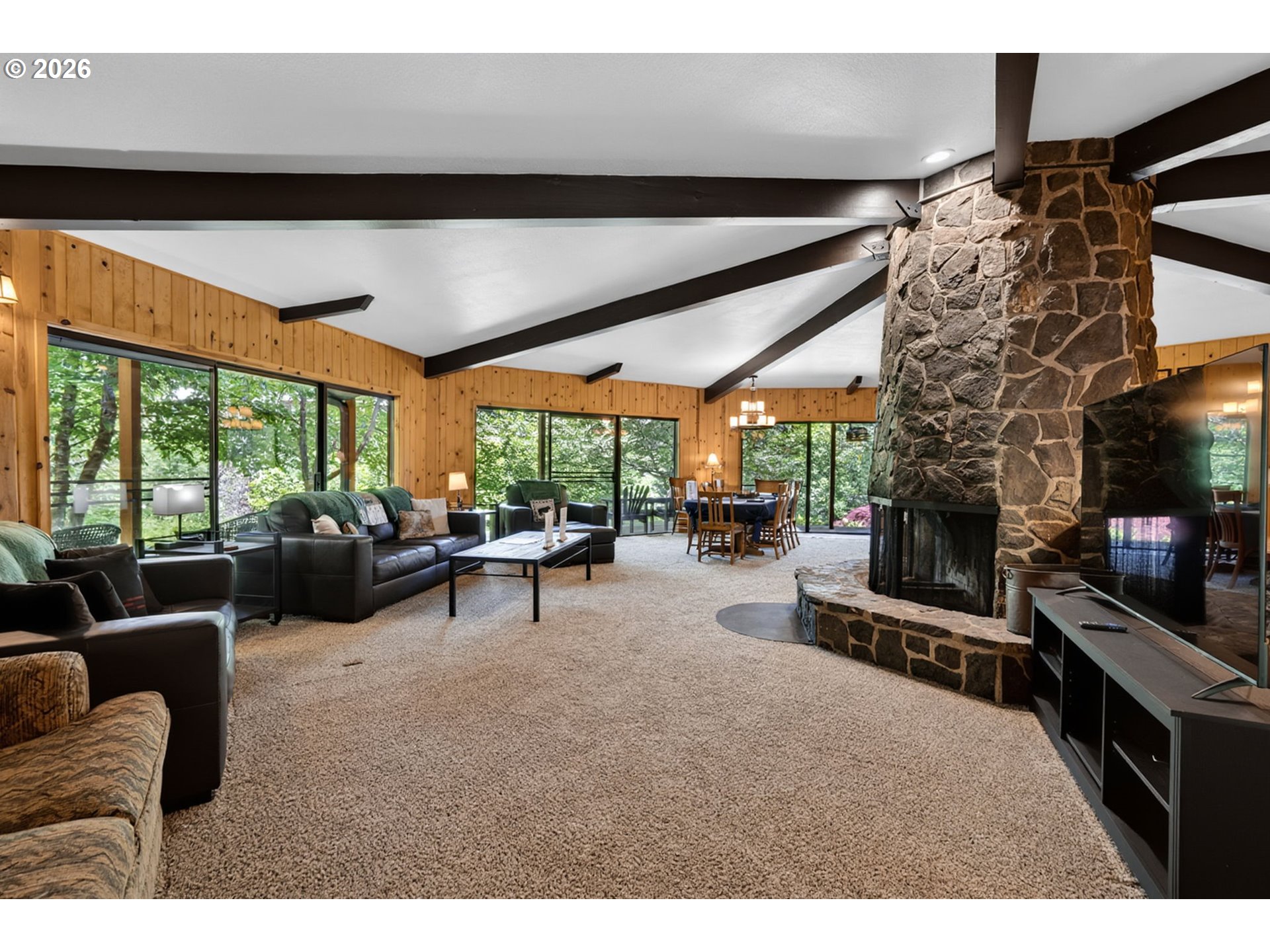 46725 Goodpasture Road Vida, OR 97488 - Photo 6 of 48 a living room with furniture a flat screen tv and a fireplace