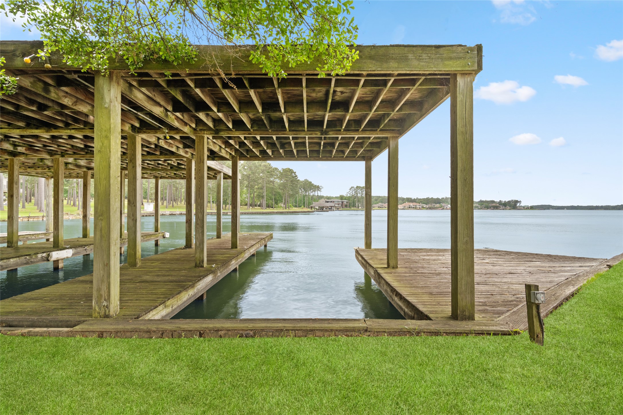 15126 Walden Road Montgomery, TX 77356 - Photo 8 of 50 Rustic yet defined boathouses featuring 3 slips- perfect for boating enthusiasts and family water days.