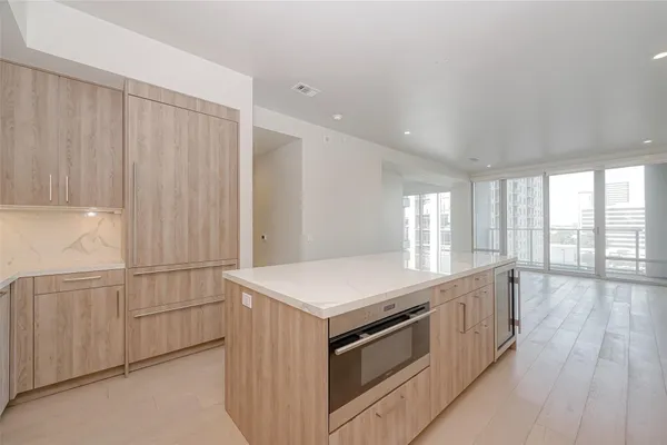 a kitchen that has a sink and a stove