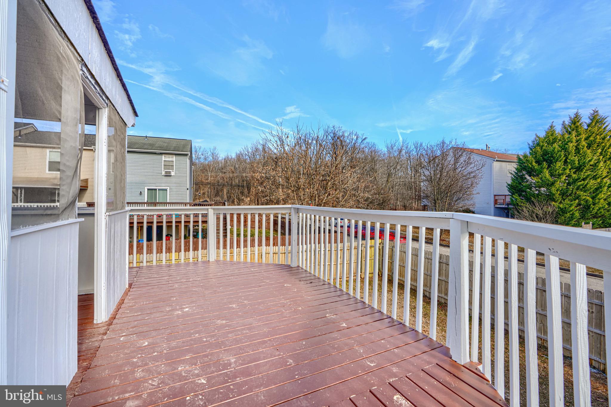 3944 Cutty Sark Road Baltimore, MD 21220 - Photo 11 of 27 a balcony with trees in front of it