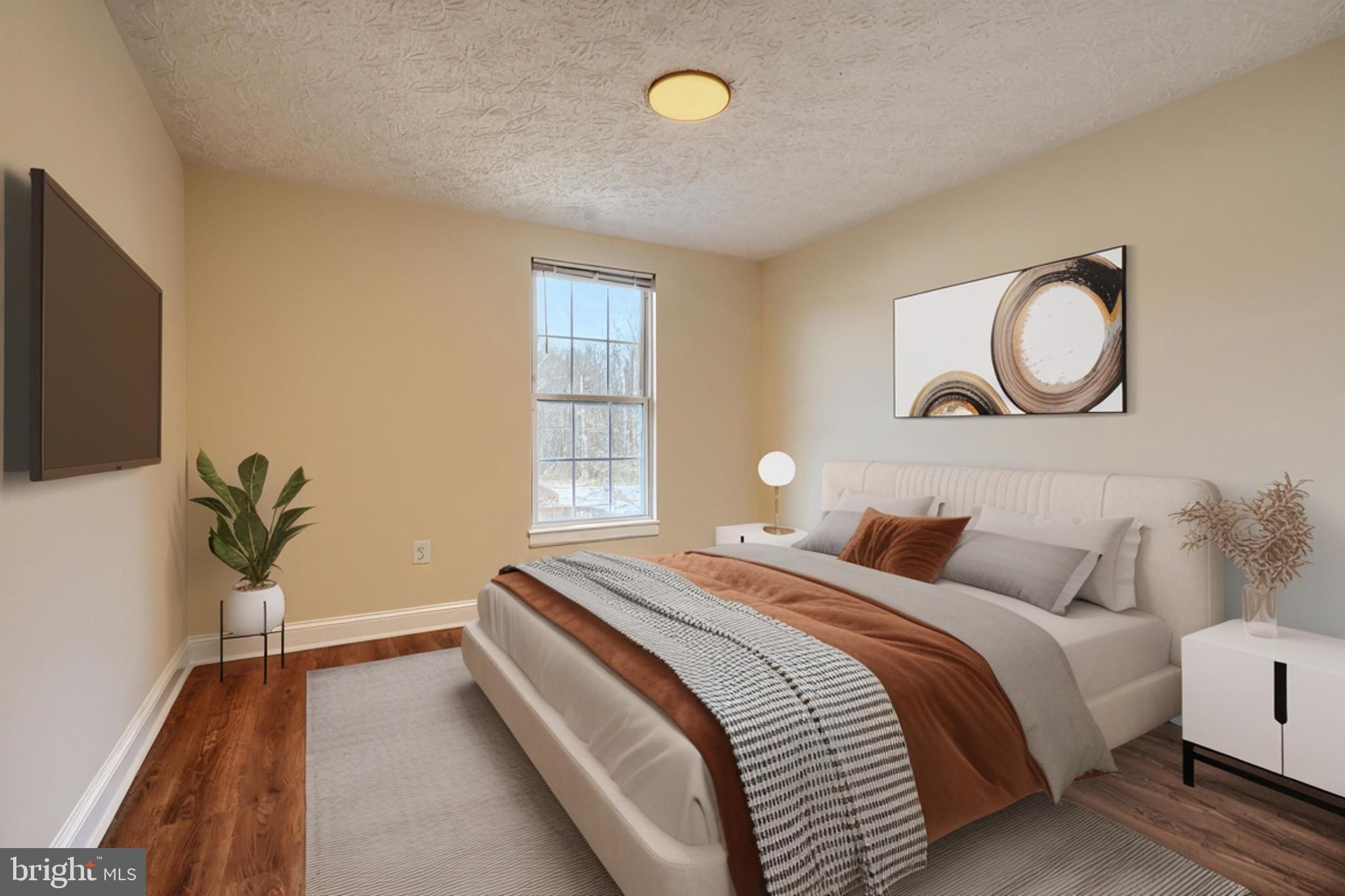 3944 Cutty Sark Road Baltimore, MD 21220 - Photo 12 of 27 a bedroom with bed and a window