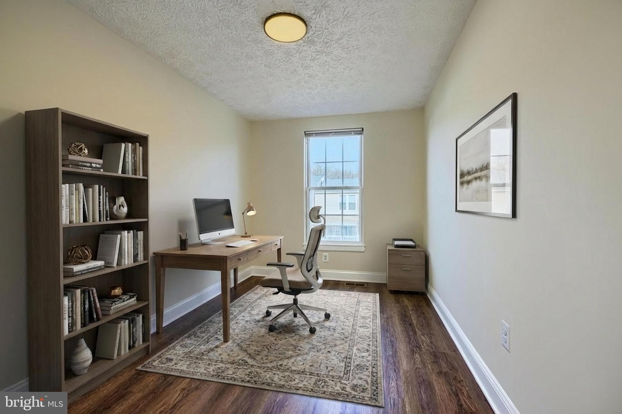 3944 Cutty Sark Road Baltimore, MD 21220 - Photo 14 of 27 a work room with furniture and a book shelf