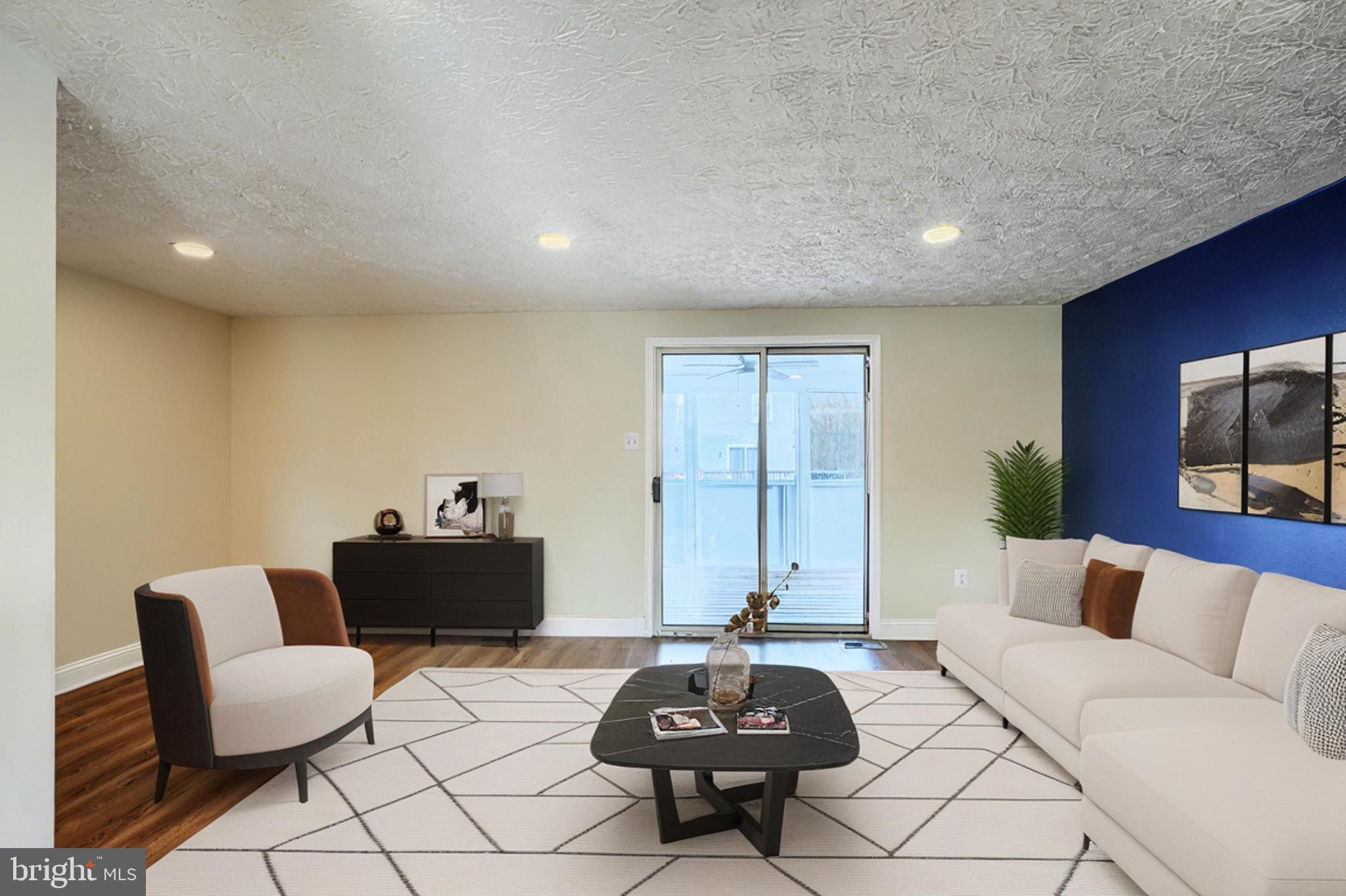 3944 Cutty Sark Road Baltimore, MD 21220 - Photo 2 of 27 a living room with furniture and a couch