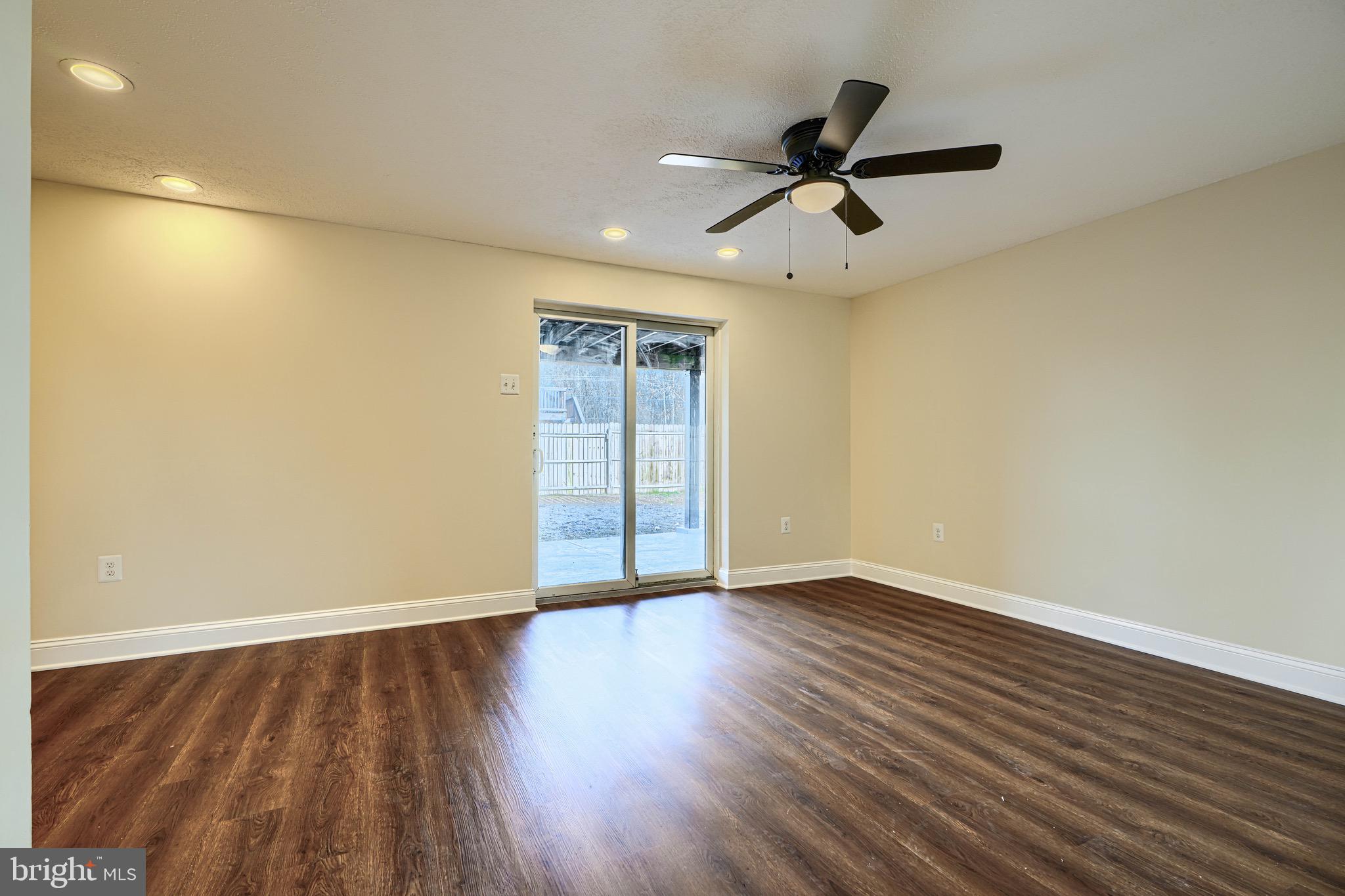 3944 Cutty Sark Road Baltimore, MD 21220 - Photo 21 of 27 wooden floor in an empty room with a window