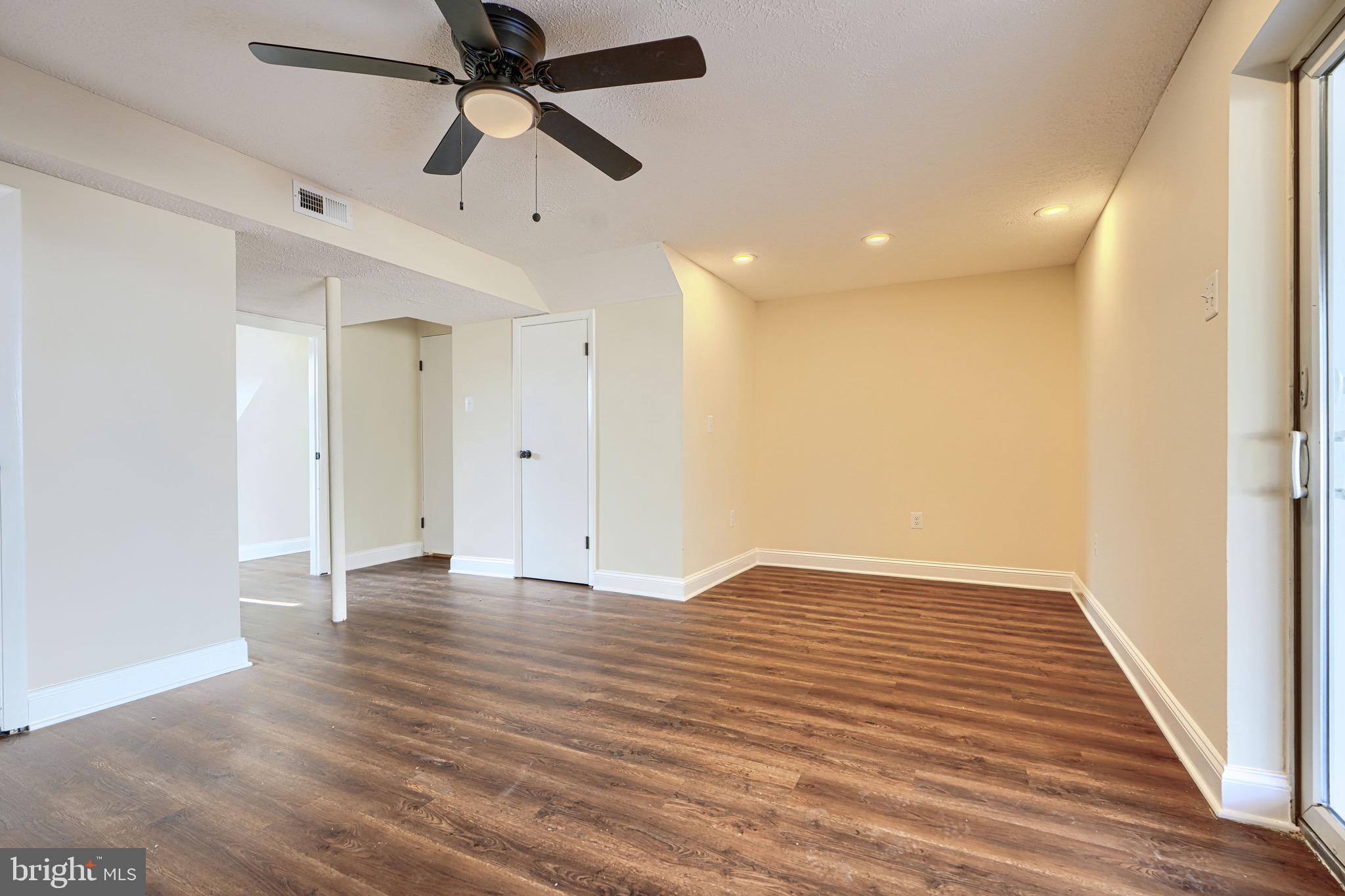 3944 Cutty Sark Road Baltimore, MD 21220 - Photo 22 of 27 wooden floor in an empty room with a window