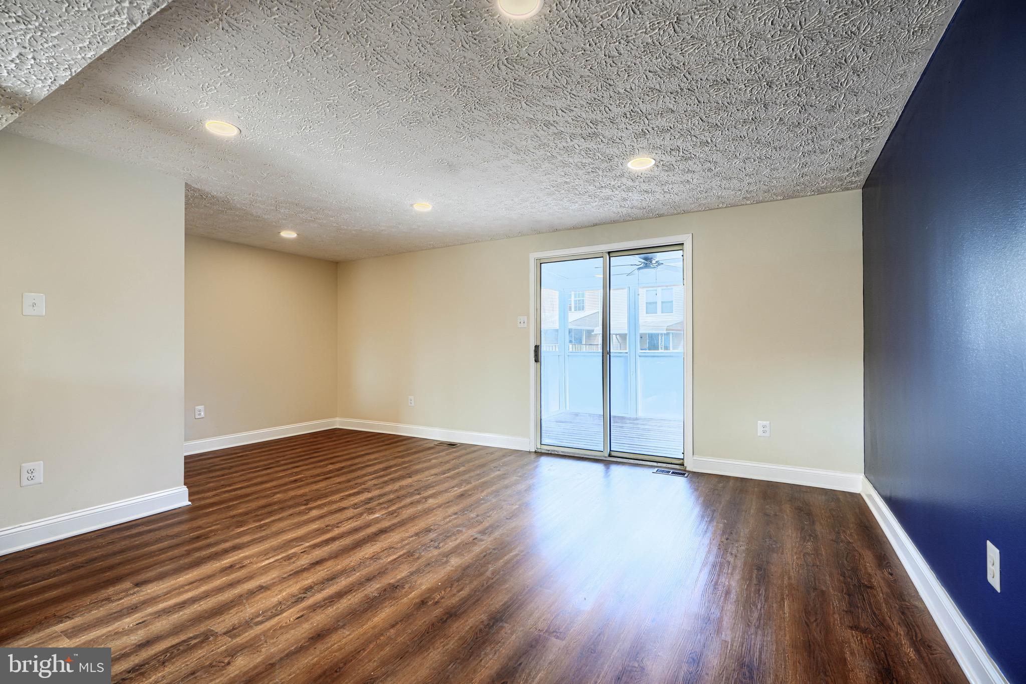 3944 Cutty Sark Road Baltimore, MD 21220 - Photo 3 of 27 a view of an empty room with wooden floor