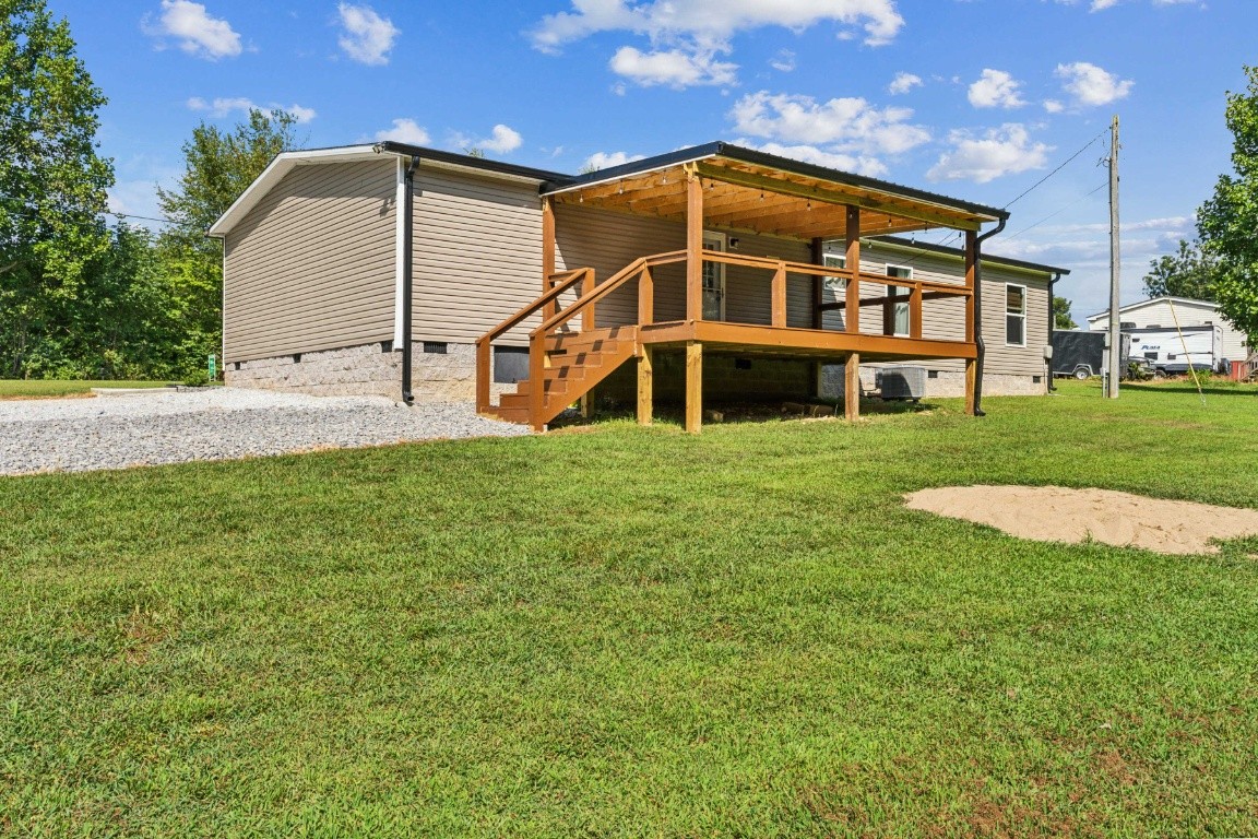 235 Antioch Road Lafayette, TN 37083 - Photo 6 of 17 a view of a house with a yard