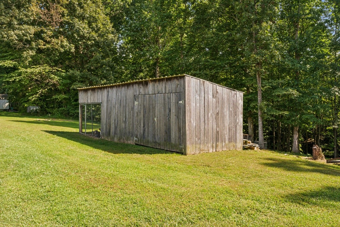 235 Antioch Road Lafayette, TN 37083 - Photo 8 of 17 a house with swimming pool in front of it