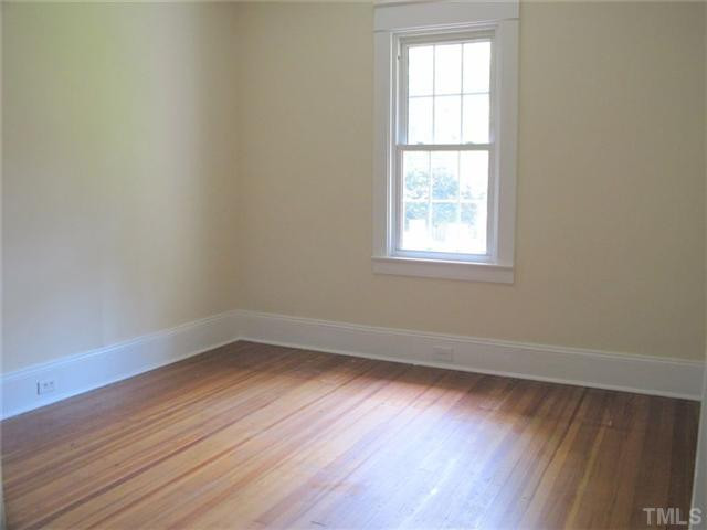 307 Perry Street Raleigh, NC 27608 - Photo 8 of 11 All bedrooms have nice wood floors, tall windows and convenient access to home amenities. Master bedroom includes private adjoining bath. Bedroom