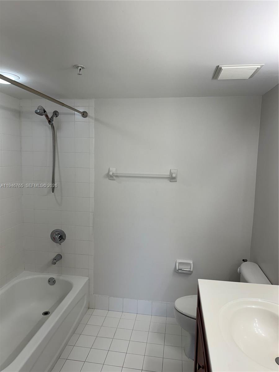 36 Northwest 6th Avenue, Unit 1106 Miami, FL 33128 - Photo 22 of 34 a bathroom with a sink a toilet and bathtub