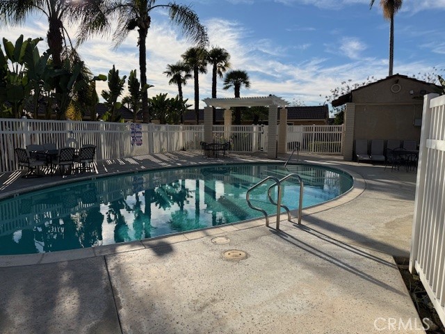 708 West Lambert Road, Unit 6 La Habra, CA 90631 - Photo 12 of 13 a swimming pool with outdoor seating and plants