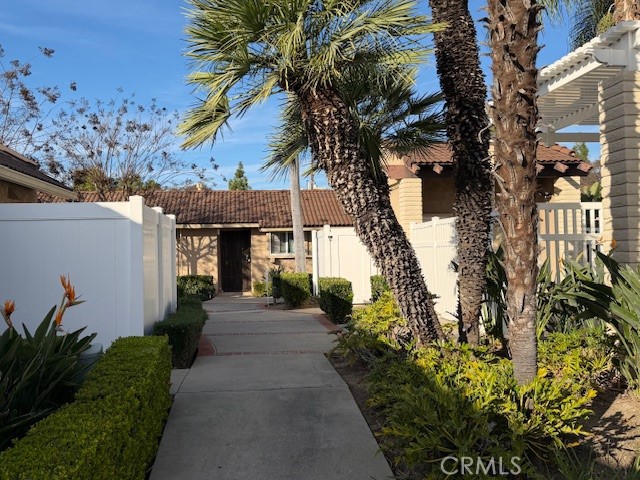 708 West Lambert Road, Unit 6 La Habra, CA 90631 - Photo 2 of 13 a front view of a house with a yard and tree s