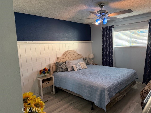 708 West Lambert Road, Unit 6 La Habra, CA 90631 - Photo 9 of 13 a bedroom with a bed and a chandelier
