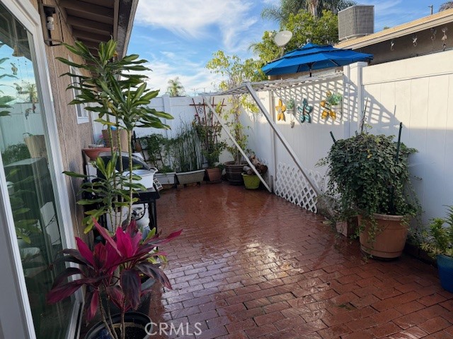 708 West Lambert Road, Unit 6 La Habra, CA 90631 - Photo 10 of 13 a potted plant sitting in front of a house