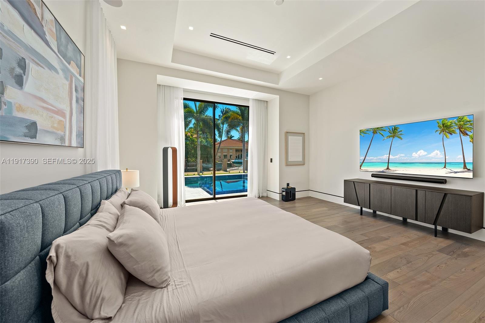 900 Washington Street Hollywood, FL 33019 - Photo 26 of 61 a bed sitting in a bedroom next to a window