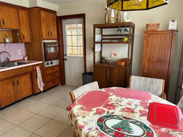 a bed room with a bed and a television