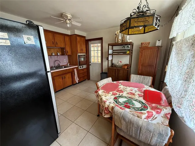 a kitchen with refrigerator cabinets and a sink