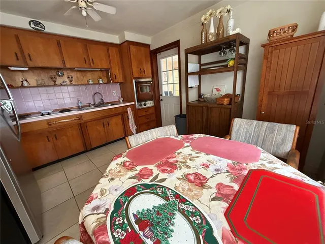 a kitchen with stainless steel appliances granite countertop a refrigerator sink and cabinets