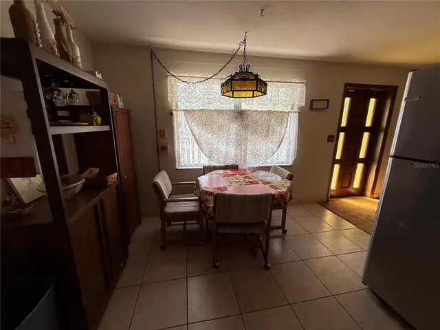 a view of a chairs and a table in a patio