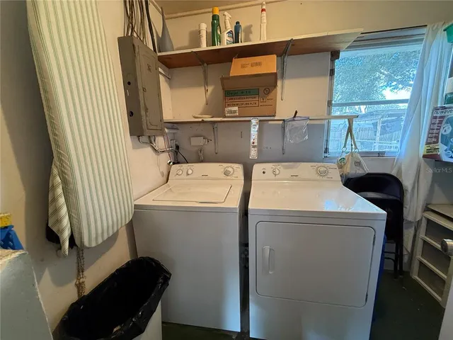 a bedroom with a bed and a table in it