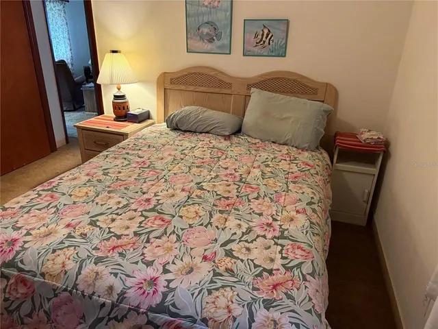 a bedroom with a bed and a chair