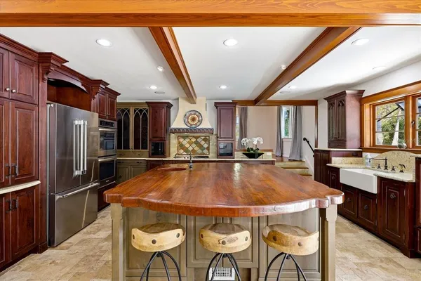 a kitchen with a sink and living room