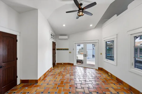 a swimming pool with barbeque oven and potted plants
