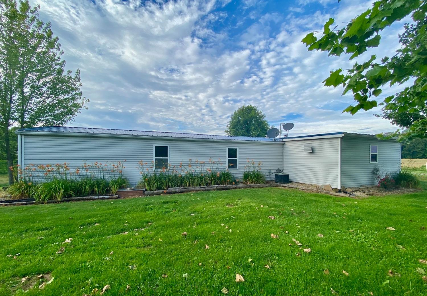 15074 Franklin Road Brookville, IN 47012 - Photo 5 of 49 Backof the home, newer siding and metal roof.