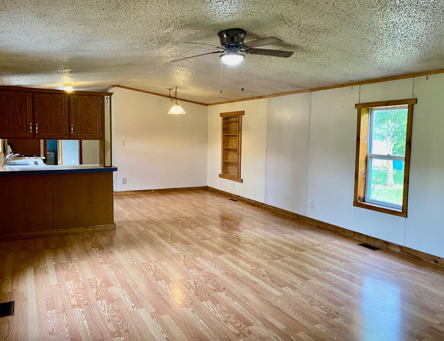 15074 Franklin Road Brookville, IN 47012 - Photo 8 of 49 Laminate flooring in the Living, Dining and Kitchen area.